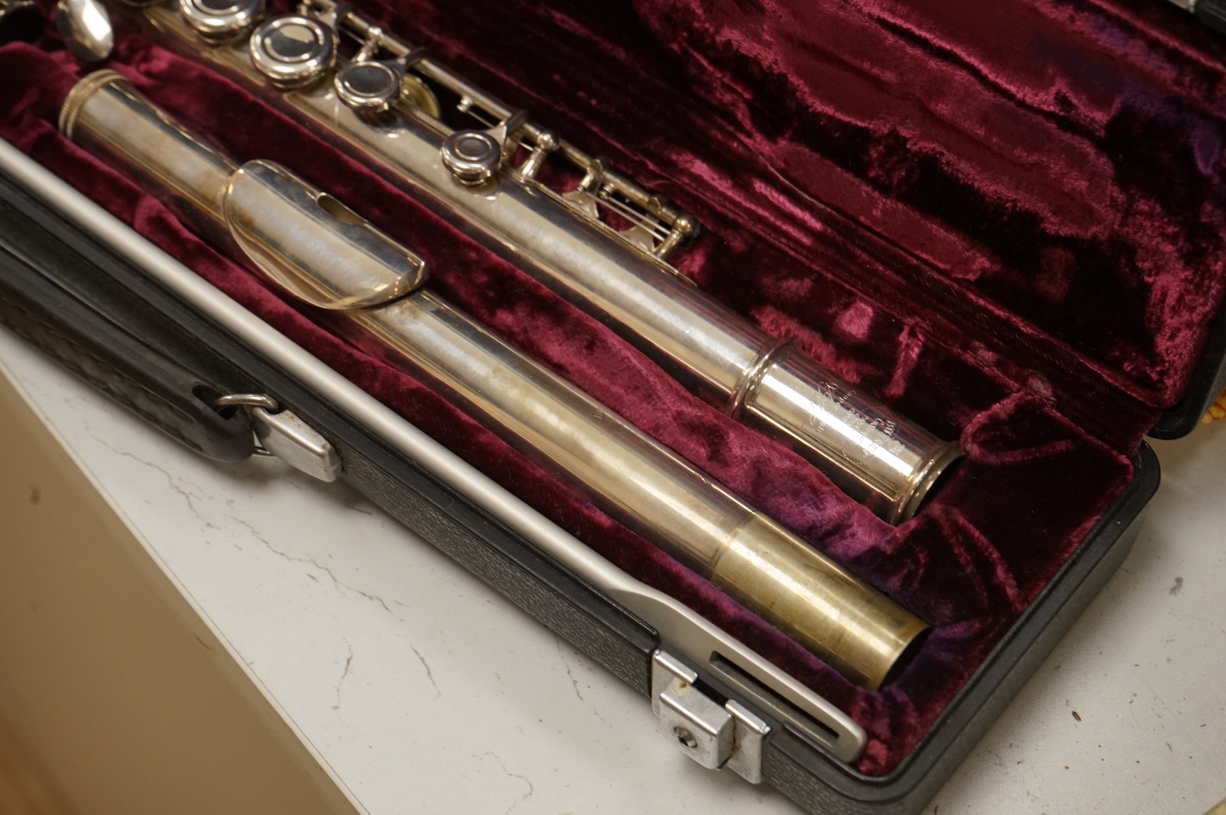 Three musical instruments to include a Buffet flute and violin with two bows